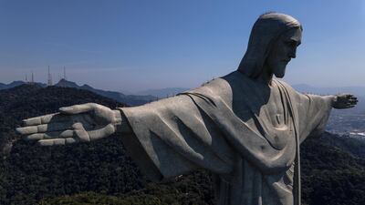 epa08605962 An aerial view of the Christ the Redeemer during its reopening to tourism, in Rio de Janeiro, Brazil, 15 August 2020. Rio de Janeiro has reopened touristic hotspots as the Sugarloaf Mountain, the aquarium, and the giant waterwheel despite warnings for the increase of coronavirus spread in the city.  EPA/Antonio Lacerda