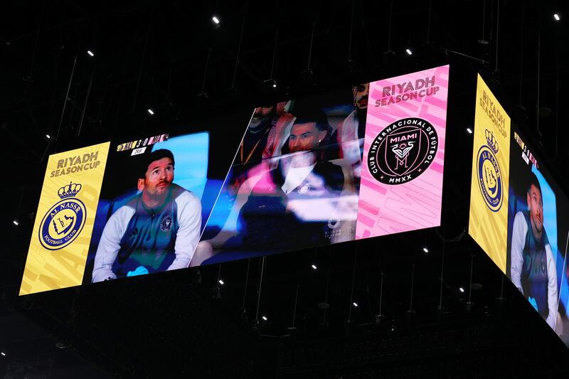 Lionel Messi of Inter Miami and Cristiano Ronaldo of Al Nassr displayed on the main screen at Kingdom Arena. The two were denied a potential last-ever meeting on the pitch due to Ronaldo's injury. AFP