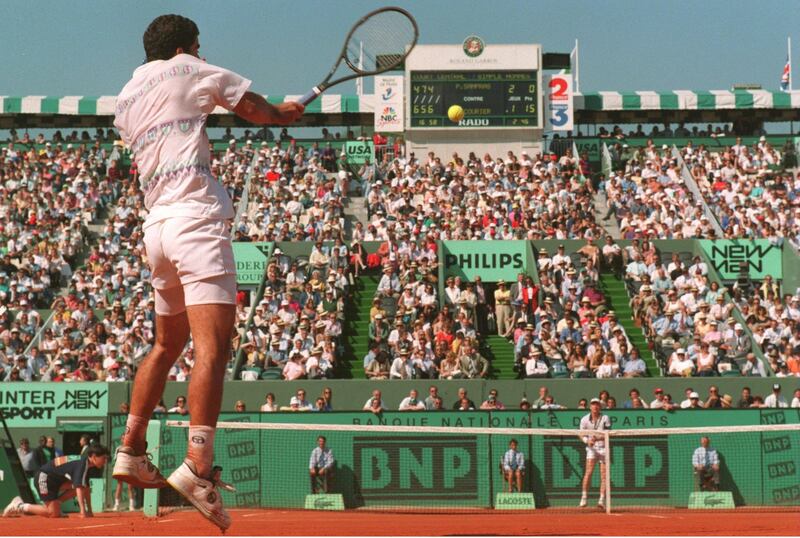 31 MAY 1994:  WORLD NUMBER 0NE PETE SAMPRAS OF THE USA JUMPS OFF THE GROUND TO PLAY A FOREHAND RETURN AS NUMBER SEVEN SEED JIM COURIER OF THE USA WAITS ON THE OTHER SIDE OF THE COURT IN ONE OF THE QUARTERFINALS OF THE FRENCH OPEN TENNIS AT ROLAND GARROS,PARIS.  Mandatory Credit: Gary Prior/ALLSPORT