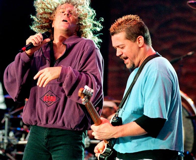 In this June 5, 1995, file photo, the former singer of the rock group Van Halen, Sammy Hagar, left, and lead guitarist Eddie Van Halen, right, perform at the concert Rock am Ring in Germany. AP