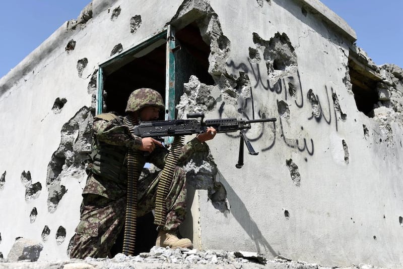 A member of the Afghan security force takes position during an operation against ISIS in Nangarhar province, Afghanistan, in 2017. EPA