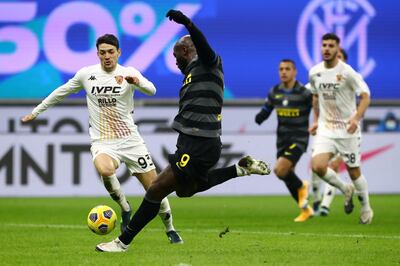 MILAN, ITALY - JANUARY 30: Romelu Lukaku of Internazionale scores their side's fourth goal during the Serie A match between FC Internazionale  and Benevento Calcio at Stadio Giuseppe Meazza on January 30, 2021 in Milan, Italy. Sporting stadiums around Italy remain under strict restrictions due to the Coronavirus Pandemic as Government social distancing laws prohibit fans inside venues resulting in games being played behind closed doors. (Photo by Marco Luzzani/Getty Images)