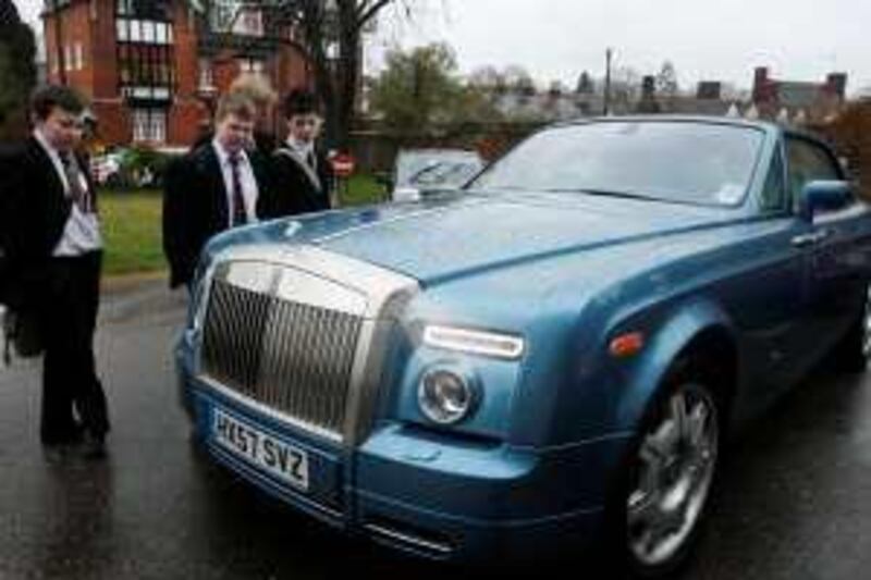 School boys admire the 2009 Rolls Royce Coupe Convertible in Cranbrook, England. RANDY QUAN FOR THE NATIONAL