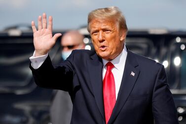 US President Donald Trump waves as he arrives at Palm Beach International Airport in West Palm Beach on January 20. Reuters