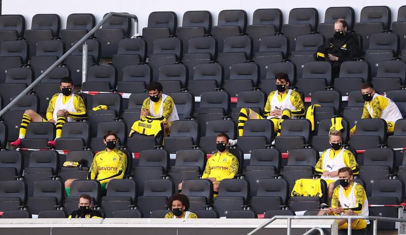 Substitutes of Borussia Dortmund look on from the stands during the match against SC Paderborn. Getty