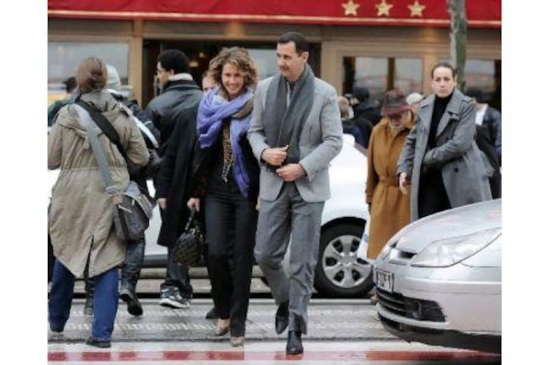 The Syrian president, Bashar al Assad, and his wife Asma walking in a street in Paris during a two-day official visit to France. Switzerland said on May 24, 2011 it has frozen any assets that Mr al Assad may have in the country. Miguel Medina / AFP Photo