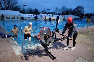 Early morning swimmers at Hampton Lido take their first dip in months with England's lockdown rules eased on Monday. Reuters