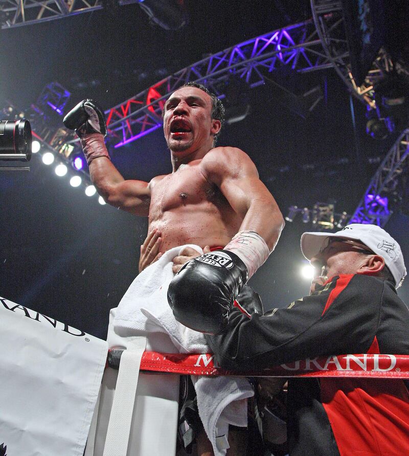 Juan Manuel Marquez celebrates after he knocked out Manny Pacquiao in the 6th round of their welterweight fight on December 8, 2012, at the MGM Grand Garden in Las Vegas, Nevada.  AFP PHOTO / John Gurzinski
 *** Local Caption ***  064491-01-08.jpg