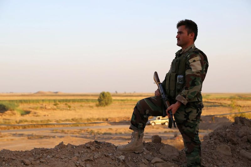 A member of the Iraqi Kurdish forces, known as the Pershmerga, stands guard near Tuz Khurmatu, 70 kilometres south of Kirkuk. Marwan Ibrahim / AFP / June 24, 2014

