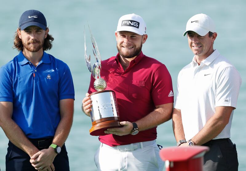 Defending Abu Dhabi HSBC Championship winner Tyrrell Hatton of England is flanked by Tommy Fleetwood of England, left, and Rory McIlroy of Northern Ireland. Getty Images