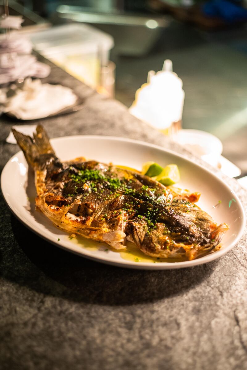 Atlantic seabass at 11 Woodfire is rubbed with a lime-salt combination that is first left to ferment for up to five weeks. Photo: 11 Woodfire 