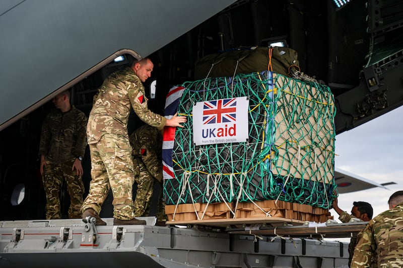 A member of 47 Air Despatch Squadron loads humanitarian aid onto an RAF A400M aircraft  to airdrop it, along the northern coastline of Gaza, as part of the Jordanian-led international aid mission, in Amman, Jordan, in this handout released March 26, 2024. RAF / UK MoD / Reuters