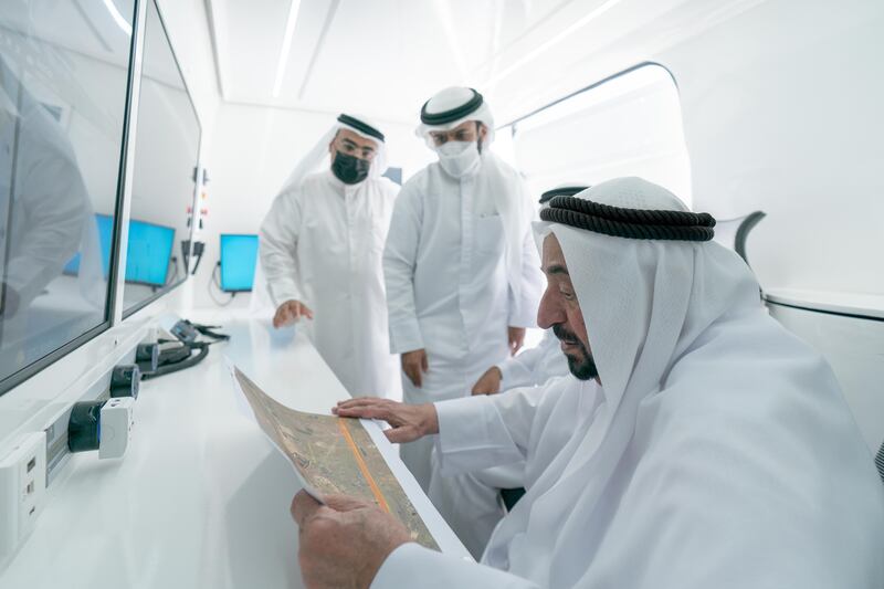 Sheikh Dr Sultan looks at a visual representation of the area surrounding the heritage sites.  