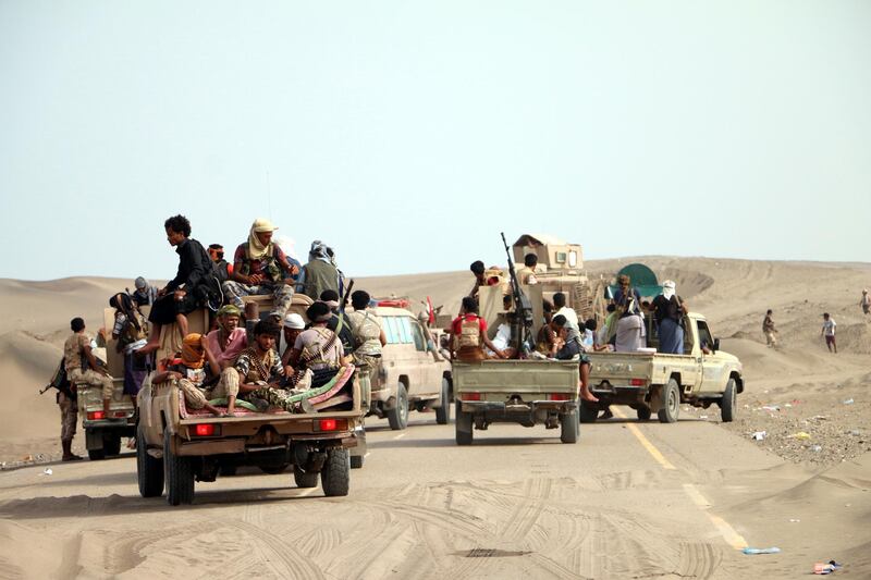 epa06768604 Yemeni government forces backed by the Saudi-led coalition take position at an area after seizing it from the Houthi militia in the western province of Hodeidah, Yemen, 27 May 2018 (issued 28 May 2018). According to reports, Yemeni troops backed by the Saudi-led coalition have moved closer to a key Houthis-held port and strategic city of Hodeidah after Yemeni government forces seized Houthis-held areas along the western coast. Most of Yemen's food and medicine imports and aid are shipped through Hodeidah port.  EPA/STRINGER