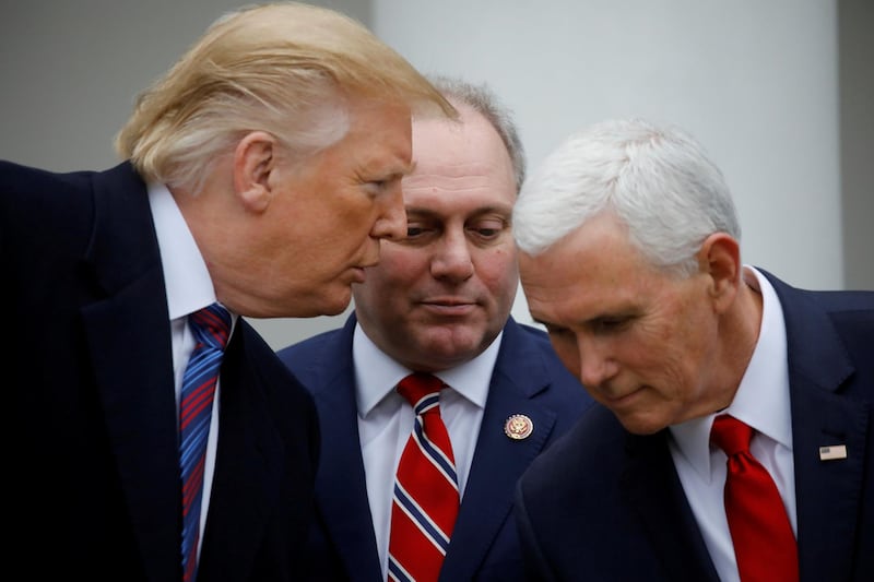 U.S. President Donald Trump confers with Vice President Mike Pence and House Minority Whip Steve Scalise (R-LA) as they faced to reporters in the Rose Garden after the president met with U.S. Congressional leaders about the government shutdown and border security at the White House in Washington, U.S., January 4, 2019. REUTERS/Carlos Barria     TPX IMAGES OF THE DAY