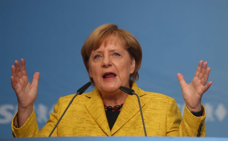 German Chancellor Angela Merkel, top candidate of the Christian Democratic Union Party (CDU) for the upcoming general elections, gestures as she speaks during an election rally in Regensburg, Germany, September 18, 2017.  REUTERS/Michael Dalder