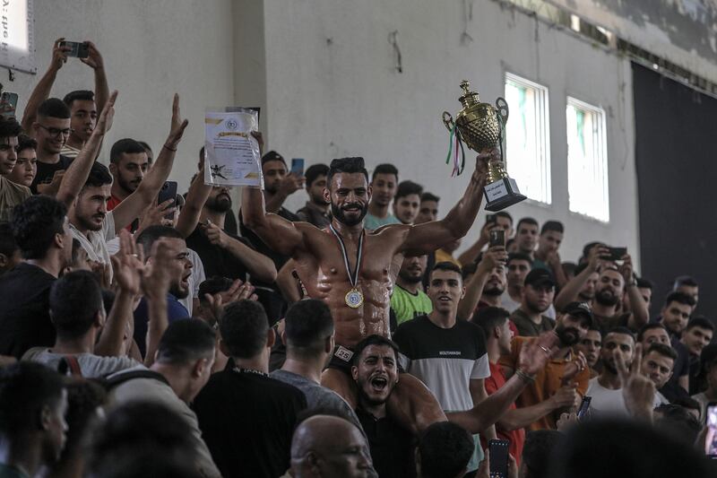 The winner of the competition poses with his trophy. EPA