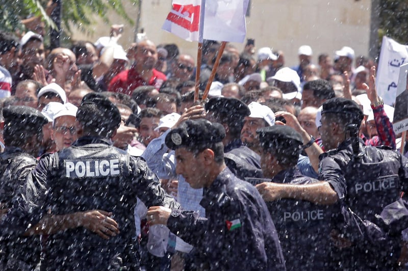 Jordanian teachers clash with security forces during a protest in the capital Amman.  AFP