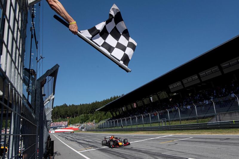 Formula One F1 - Austrian Grand Prix - Red Bull Ring, Spielberg, Austria - June 30, 2019   Red Bull's Max Verstappen takes the checkered flag to win the race   Christian Bruna/Pool via REUTERS