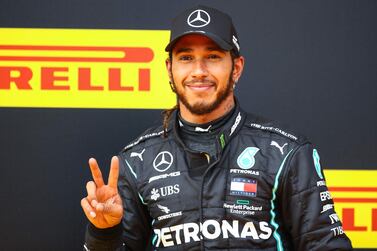 Mercedes' British driver Lewis Hamilton celebrates winning the Formula One Styrian Grand Prix. AFP