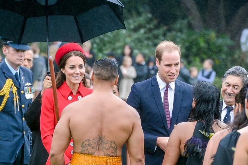 Prince William and Catherine Duchess of Cambridge talk with members of the Maori welcome group. EPA