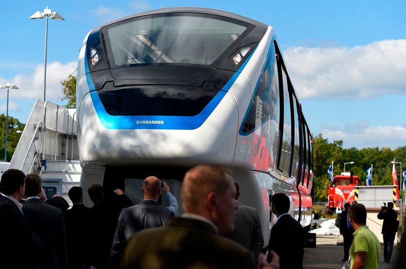 (FILES) In this file photo taken on September 23, 2014 The Innovia Monorail 300 by Bombardier is on display at the opening day of the Innotrans International Trade Fair for Transport and Mobility in Berlin. Canadian manufacturing group Bombardier announced on August 5, 2019 it had signed a multi-billion dollar agreement to build two automated monorail lines in Egypt's notoriously congested capital Cairo.  / AFP / Tobias SCHWARZ
