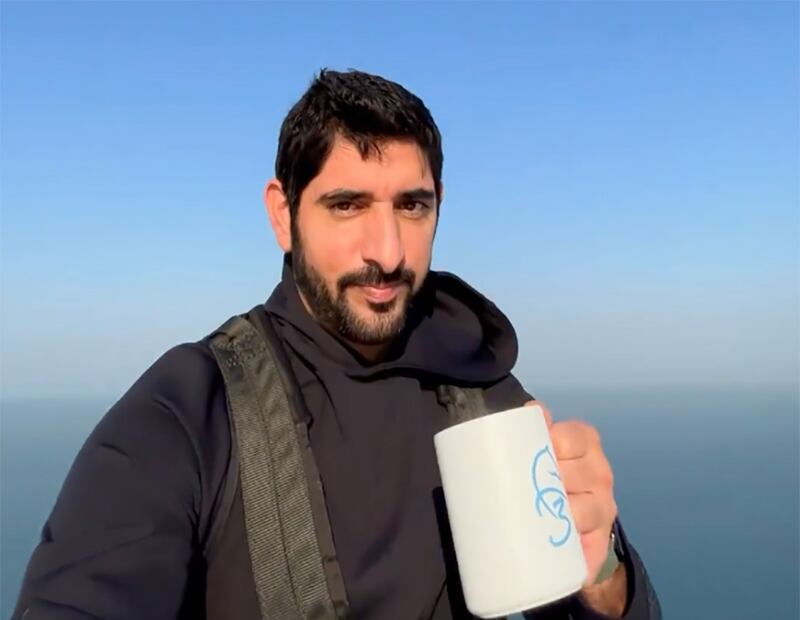 He shared a video on social media that showed him casually sipping from a mug on top of one of the cabins. Photo: Screengrab