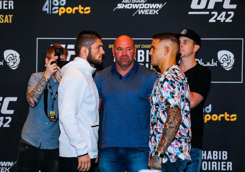 UFC president Dana White stands between Khabib Nurmagomedov, left, and Dustin Poirier at Yas Hotel in Abu Dhabi on Thursday. UFC
