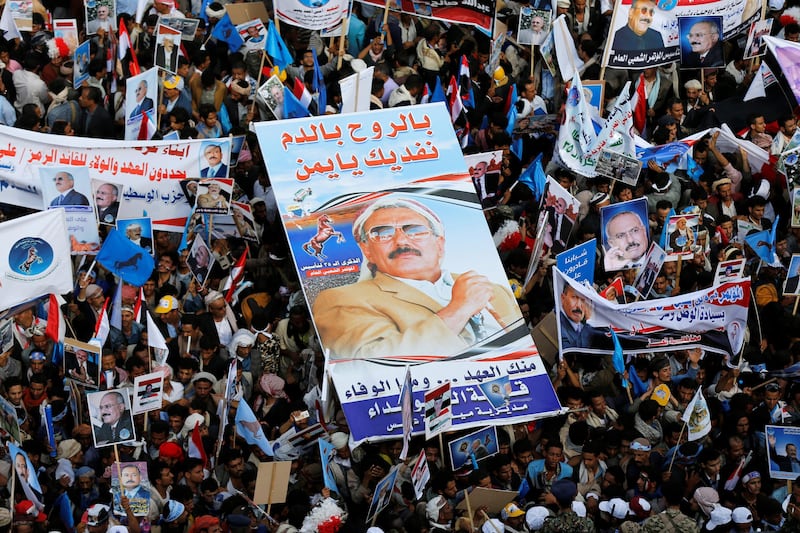 Supporters of Yemen's former President Ali Abdullah Saleh carry his poster during a rally to mark the 35th anniversary of the establishment of the General People's Congress party which is led by Saleh in Sanaa, Yemen August 24, 2017. The poster reads: "With blood and souls we sacrifice for you oh Yemen" REUTERS/Khaled Abdullah