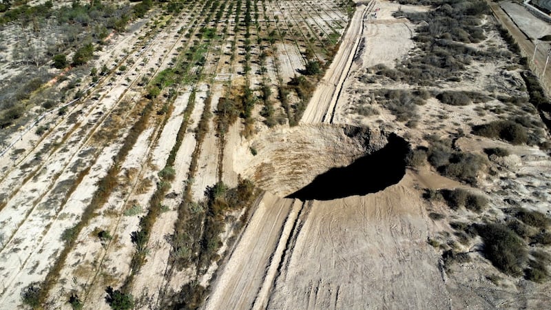 The latest sinkhole to form - a tennis court-sized depression at a copper mine in Copiapo, Chile, on August 1. Reuters