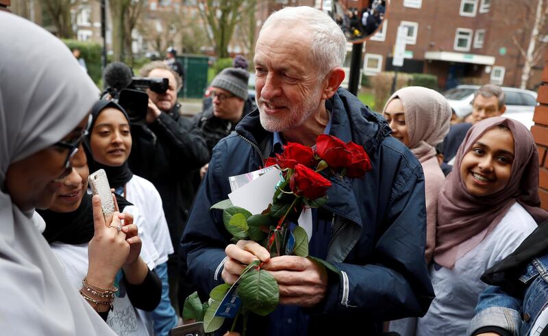 FILE PHOTO: Britain's opposition Labour Party leader, Jeremy Corbyn, is greeted by young women and red roses during a visit to Finsbury Park Mosque, on Visit My Mosque day, in London, Britain, March 3, 2019. REUTERS/Peter Nicholls/File Photo