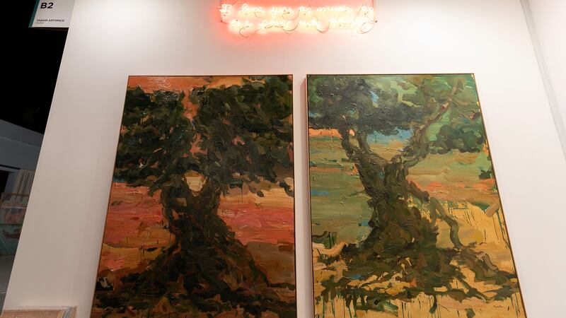 Tabari Artspace's booth features works by Aya Haidar, top, and Tagreed Darghouth. Chris Whiteoak / The National