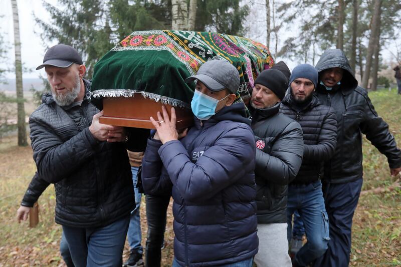 Mourners carry the coffin at the funeral of Yemeni migrant Mustafa Mohammed Murshid al-Raymi in the village of Bohoniki, near the border. EPA