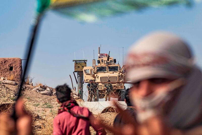 Syrian Kurds take part in a demonstration against Turkish threats  to launch an "air and ground" operation in Syria against a Kurdish militia it deems a terrorist group. AFP