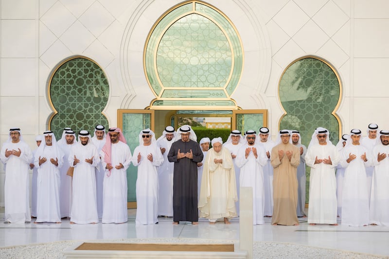 President Sheikh Mohamed prays at the tomb of UAE Founding Father, the late Sheikh Zayed bin Sultan Al Nahyan, alongside senior officials including Sheikh Mansour bin Zayed, Vice President, Deputy Prime Minister and Chairman of the Presidential Court. Photo: UAE Presidential Court