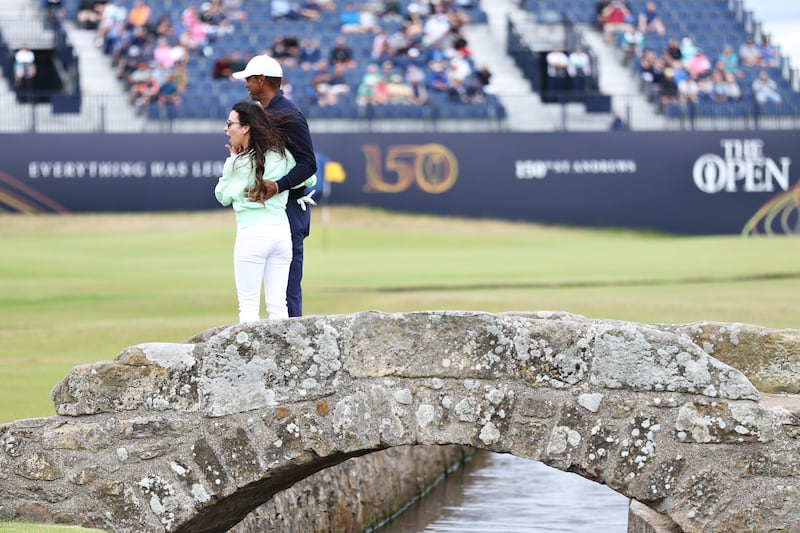 Tiger Woods alongside partner Erica Herman during a practice round. Getty