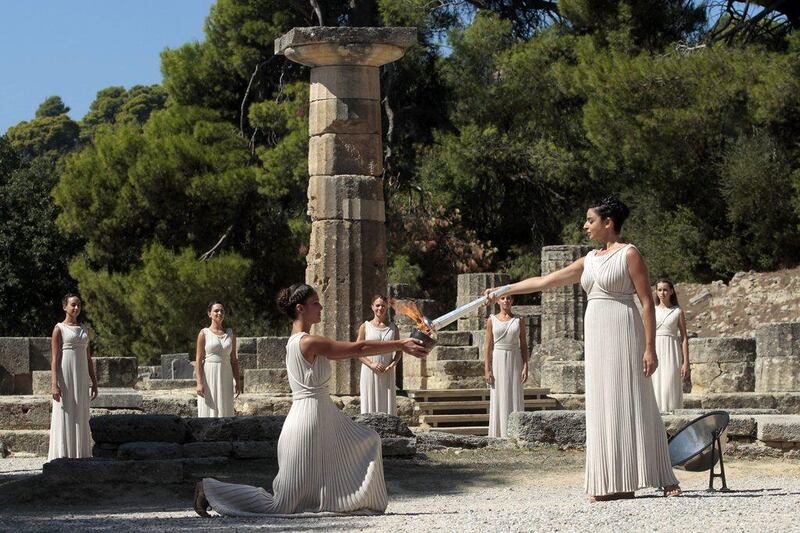 Actress Ino Menegaki, in the role of the High Priestess, lights the torch of the Olympic Flame during the Lighting Ceremony of the Olympic Flame for Sochi Winter Olympics 2014, in front of Hera Temple in Ancient Olympia, Greece. Orestis Panagiotou / EPA