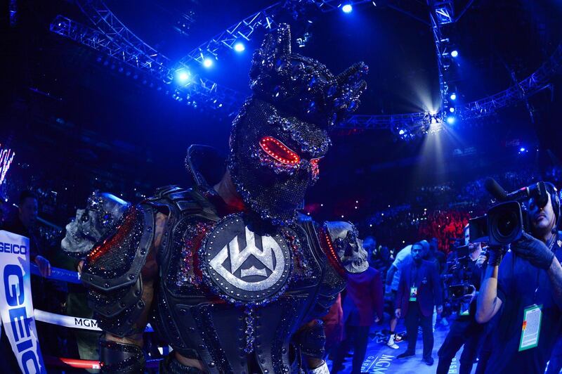Deontay Wilder enters the ring prior to the Heavyweight bout wearing a design by Cosmo & Donato. AFP