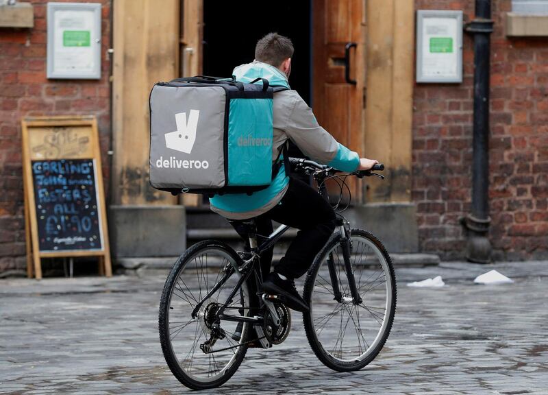 FILE PHOTO: A deliveroo worker cycles along a pedestrianised road in Liverpool, Britain, October 18, 2017. Picture taken October 18, 2017.     REUTERS/Phil Noble/File Photo