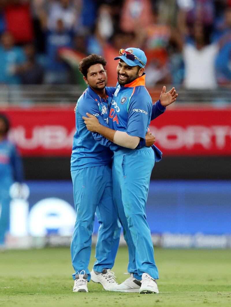 Dubai, United Arab Emirates - September 23, 2018: India's Kuldeep Yadav (L) takes the wicket of Pakistan's Sarfraz Ahmed during the game between India and Pakistan in the Asia cup. Sunday, September 23rd, 2018 at Sports City, Dubai. Chris Whiteoak / The National
