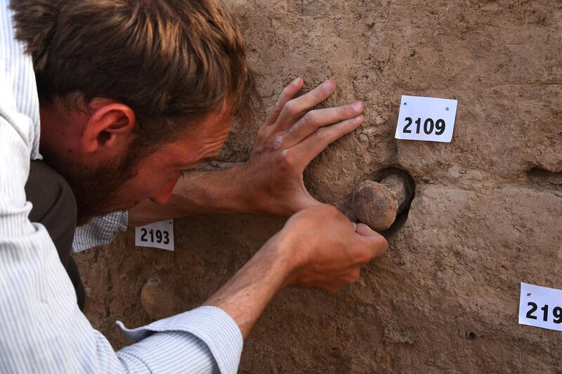 Excavating Magical Cones from the Walls of the Temple in Girsu. Courtesy British Museum