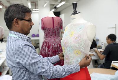 Dubai, United Arab Emirates - August 23rd, 2017: A feature on fashion designer Rami Al Ali & Karashash Nurakhmet a ESMOD fashion school intern. Karashash is designing clothes which will then be sold, and Rami Al Ali is helping lend his industry knowledge. Wednesday, August 23rd, 2017 at The Design District, Dubai. Chris Whiteoak / The National