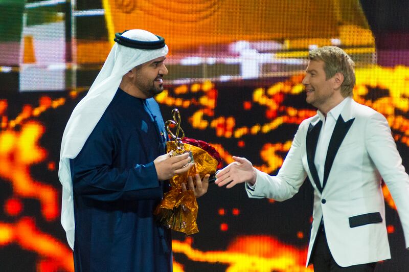 Al Jassmi receives the award for Best Middle East Artist from Nikolay Baskov at the Bravo awards in Moscow. Photo: DCT Abu Dhabi