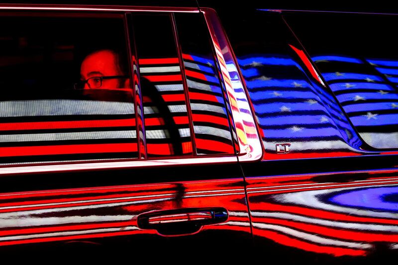 A taxi cab passenger looks out of the driver side window while passing through Times Square, following the Veterans Day Parade in Manhattan, New York, US.  Reuters