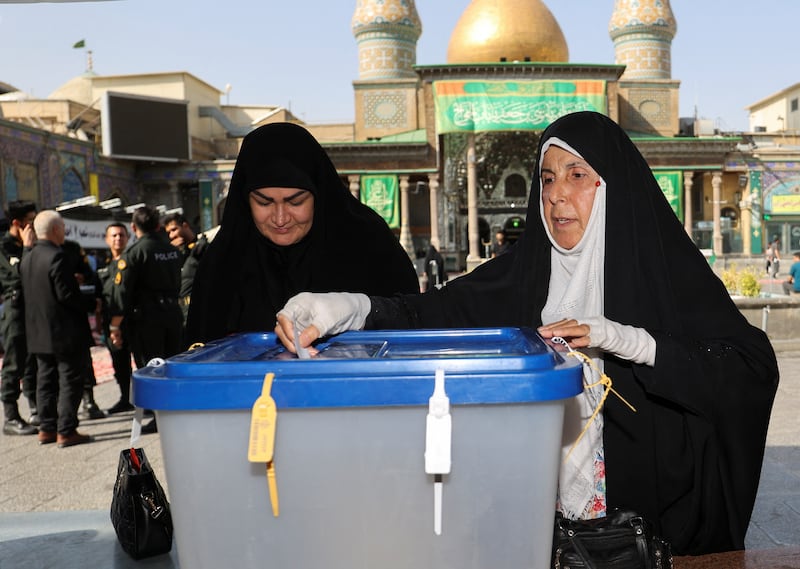 An Iranian woman votes in Tehran. The only other candidate in the race is hardliner Mostafa Pourmohammadi. Reuters
