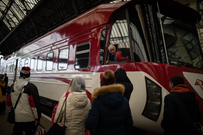A train driver tells people on the platform that he cannot pick anyone up at the station in Lviv.