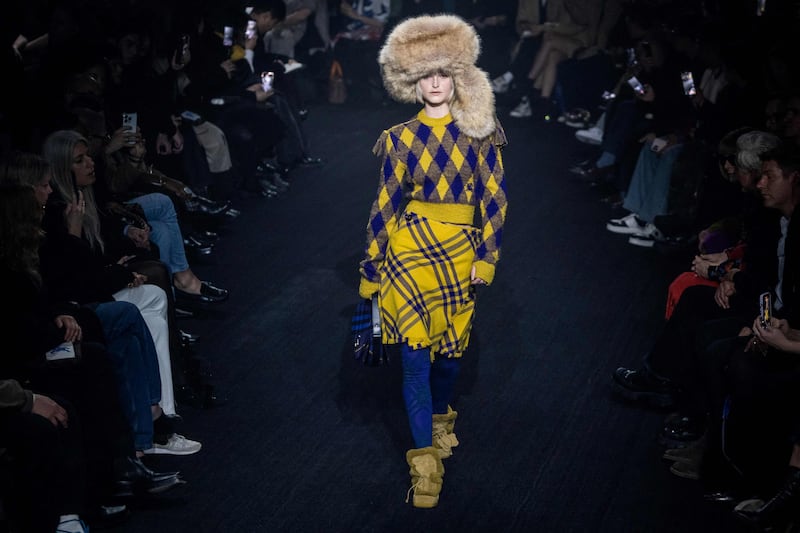 A model walks the runway during Burberry's London Fashion Week show. AFP 
