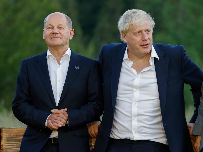 Germany's Chancellor Olaf Scholz, left, and former British prime minister Boris Johnson attend the Group of Seven summit in Germany earlier this year. AFP