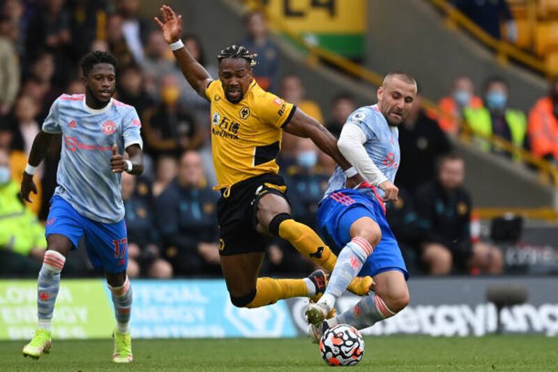 Wolves' Adama Traore battles for possession with Luke Shaw of Manchester United. Getty