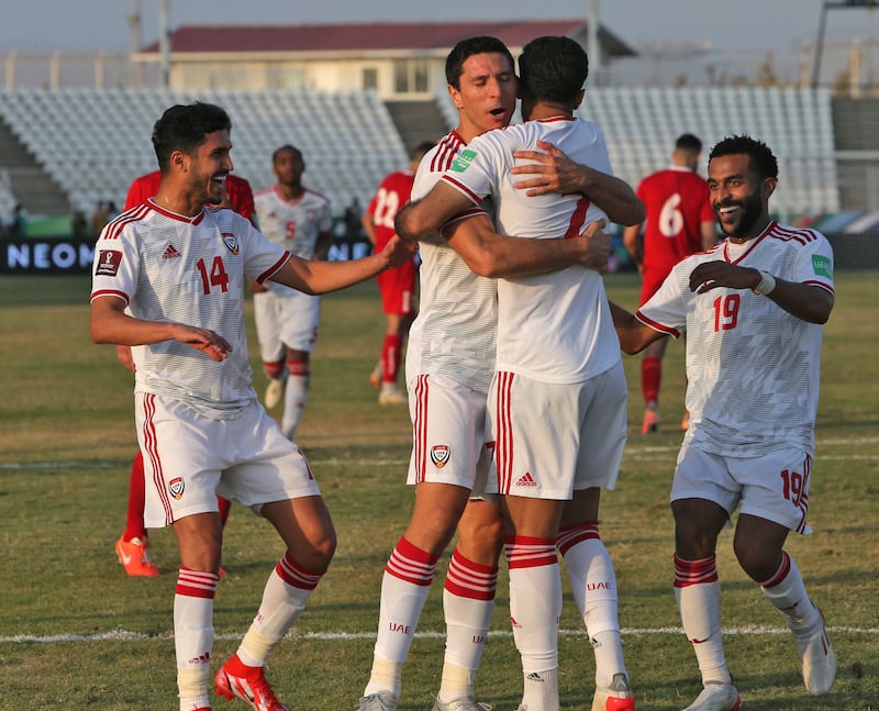 UAE's Ali Mabkhout celebrates with his teammates after scoring. AFP